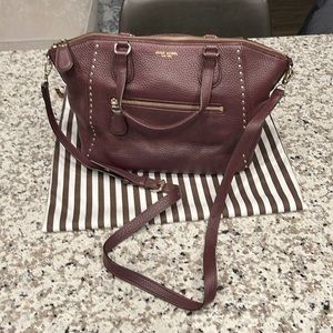 Gently used wine/plum Henri Bendel bag. Comes with bag cover.